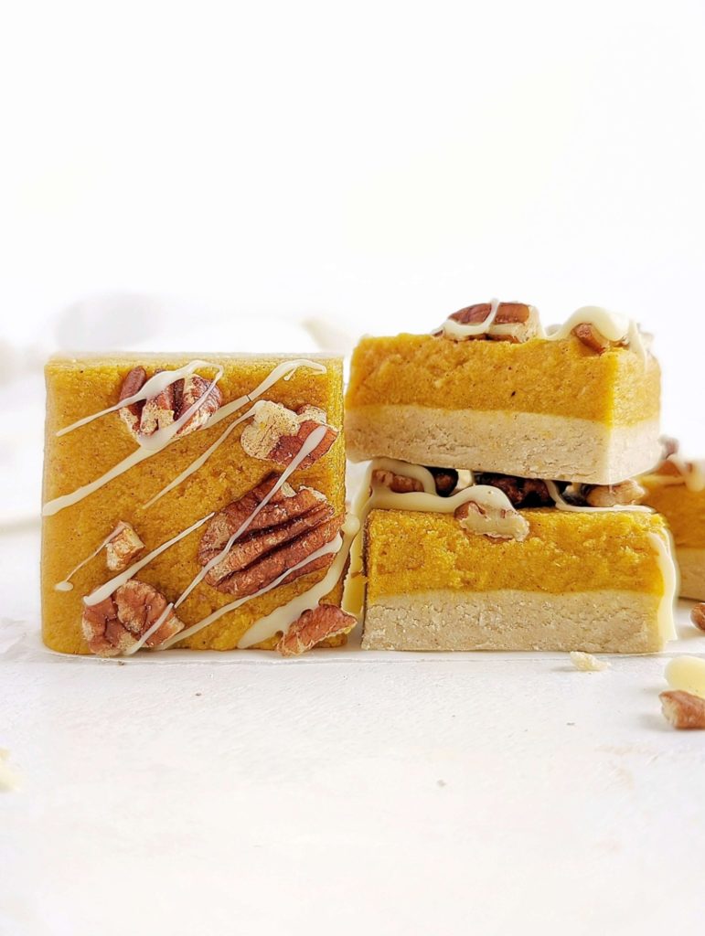 Pretty and perfect No Bake Pumpkin Protein Bars with a protein base and protein pumpkin pie layer! These homemade pumpkin pie protein bars use protein powder and monkfruit and are sugar free, gluten free, vegan and low calorie too!
