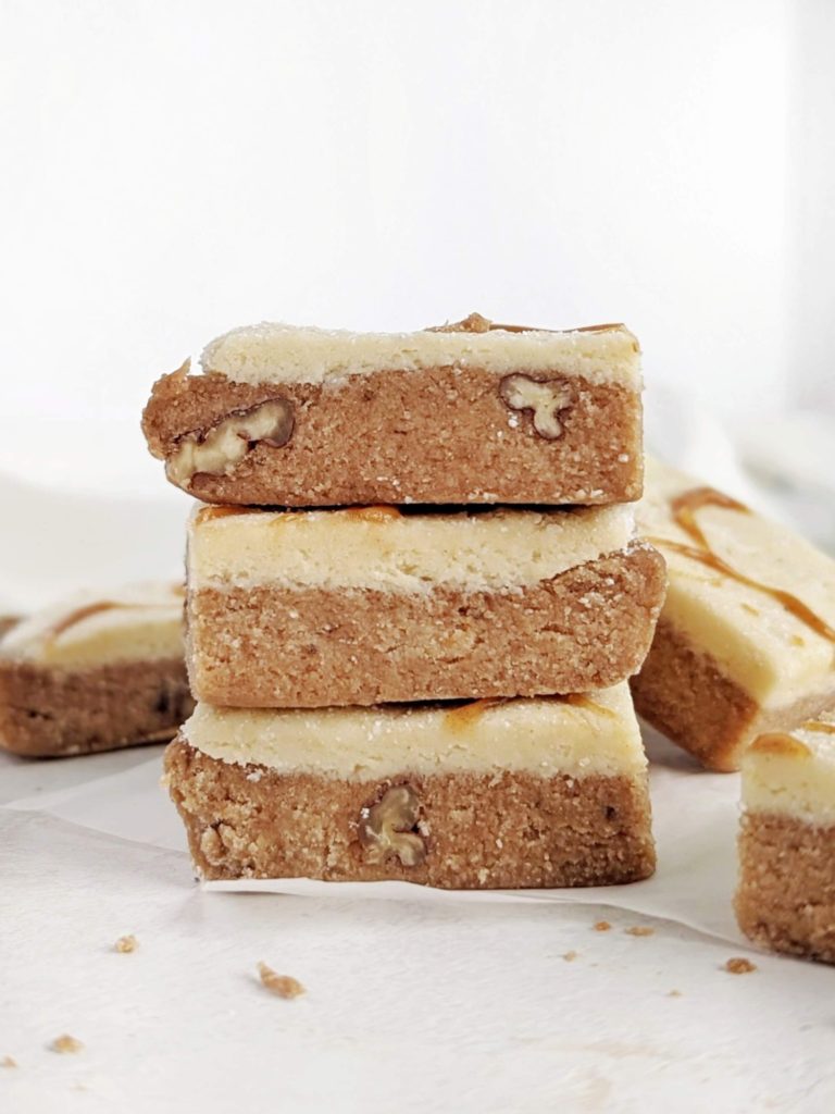 The best no bake Banana Protein Bars with a protein packed banana and frosting layer! These banana bread protein bars are low fat, low carb, gluten free and have no added sugar.