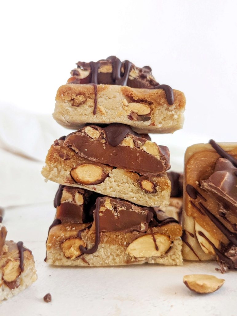 Easy homemade Caramel Almond Protein Bars with flavor and texture but no sugar! These healthy caramel protein bars use protein powder, oat flour and peanut butter powder, for a sugar free and gluten free snack.