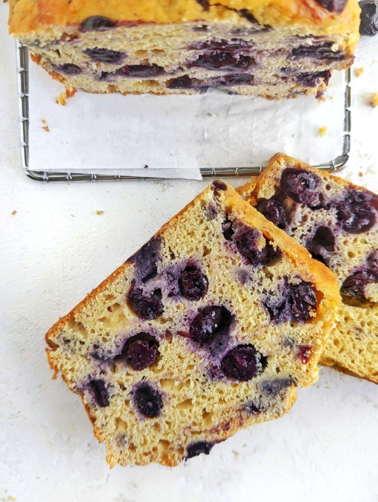 Fresh and festive Protein Blueberry Eggnog Bread for breakfast, post workout or dessert. This healthy eggnog bread uses fresh blueberries, protein powder and almond milk nog, and has no oil or sugar added!