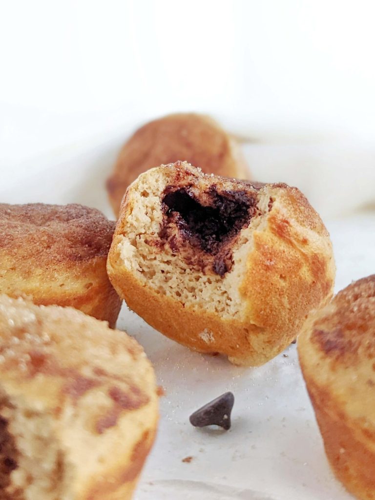 Surprise Chocolate Stuffed Churro Protein Muffins like fresh soft churros and dipping sauce in one! These healthy cinnamon sugar protein muffins are sweetened with protein powder and use sugar free chocolate and cinnamon-’sugar’ topping!