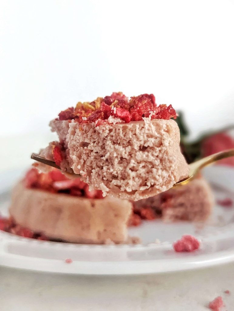 A pretty amazing Protein Strawberry Crunch Cake for a healthy single serving dessert! This strawberry protein mug cake has a no bake strawberry crunch crumble topping and is low carb, gluten free and has no added sugar!