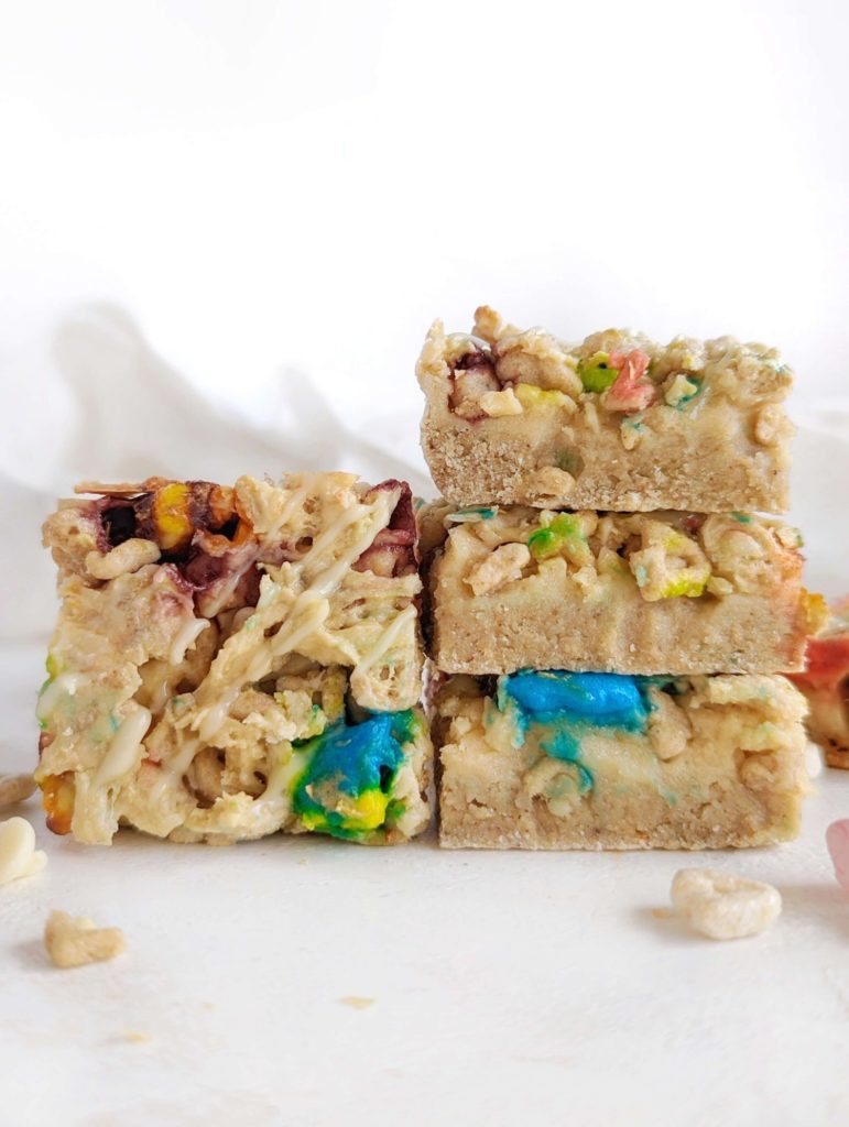 Amazing soft baked Lucky Charms Protein Bars with cereal flavored protein powder, almond butter, and actual cereal. These healthy lucky charms treats are gluten free, low fat and low sugar too!