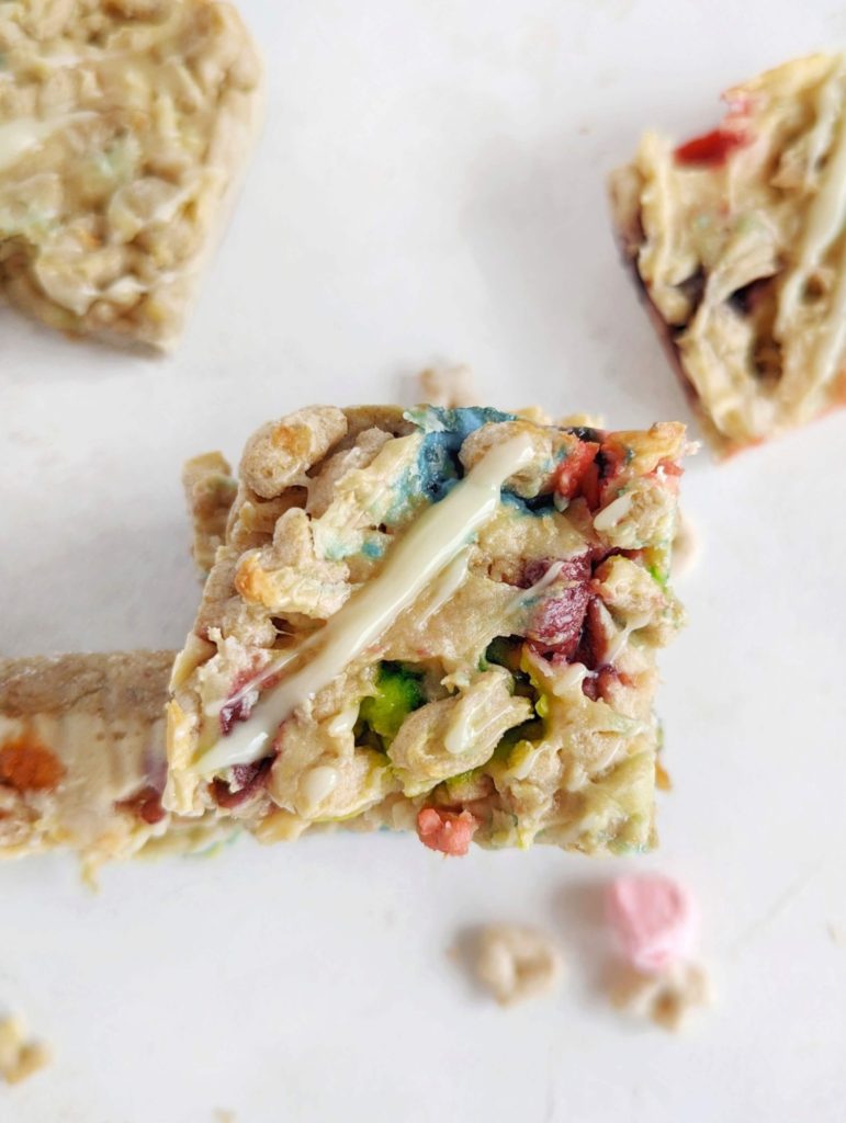 Amazing soft baked Lucky Charms Protein Bars with cereal flavored protein powder, almond butter, and actual cereal. These healthy lucky charms treats are gluten free, low fat and low sugar too!