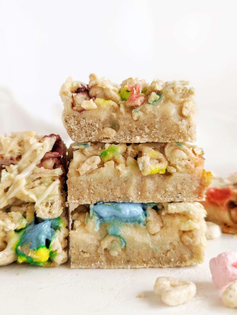Amazing soft baked Lucky Charms Protein Bars with cereal flavored protein powder, almond butter, and actual cereal. These healthy lucky charms treats are gluten free, low fat and low sugar too!