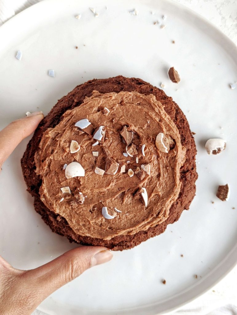 A rich and big single serve Mini Egg Protein Cookie with a protein chocolate frosting too! This healthy mini egg cookie uses protein powder and has no sugar or butter added - a great Easter dessert for one. 