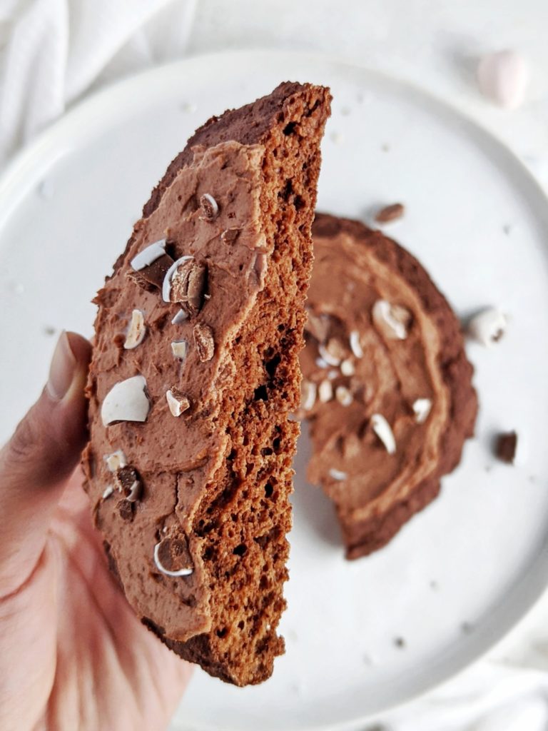 A rich and big single serve Mini Egg Protein Cookie with a protein chocolate frosting too! This healthy mini egg cookie uses protein powder and has no sugar or butter added - a great Easter dessert for one. 