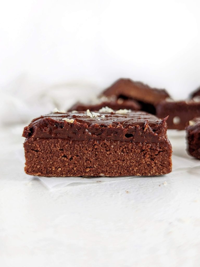 Amazing fudgy No Bake Protein Brownies with a rich base and indulgent topping! These healthy no bake brownies use protein powder and oat flour, and have no dates; Sugar free and gluten free!