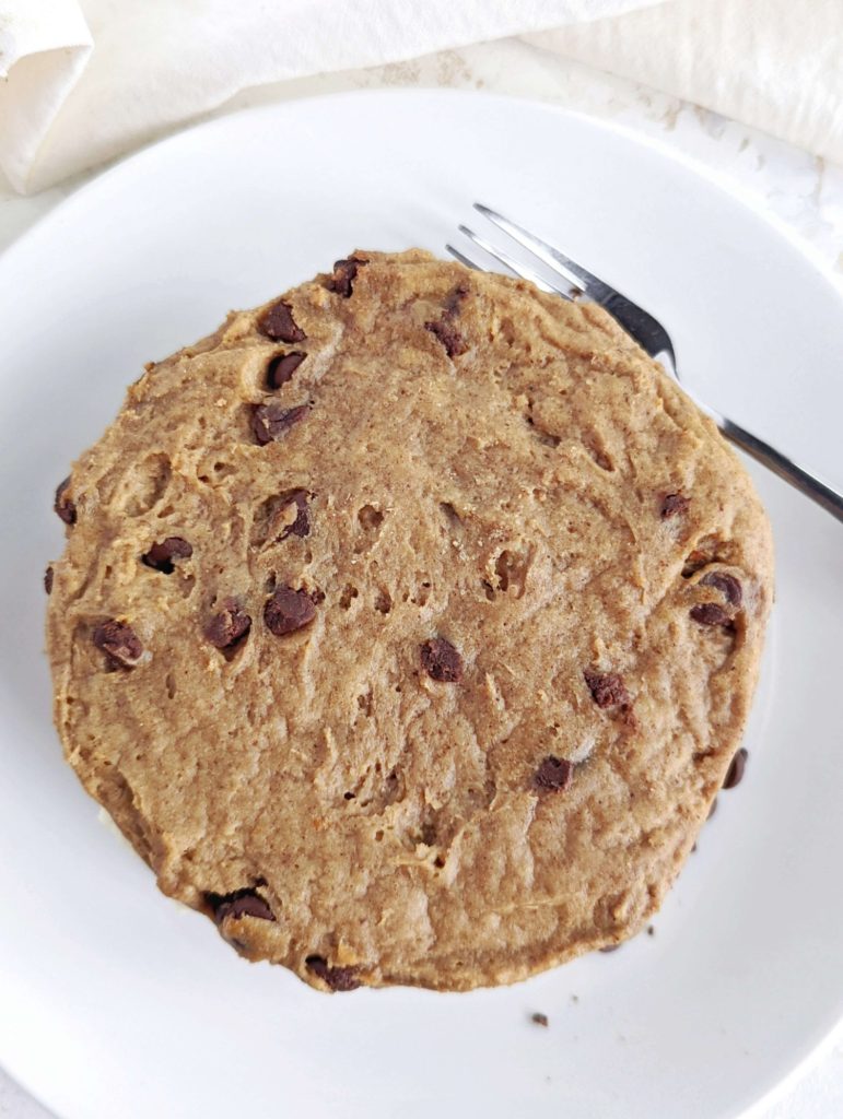 A lovely Protein Cookie Cake with protein frosting layered between protein cookies! This healthy cookie cake recipe uses protein powder for sweetener and is sugar free, gluten free, low fat and vegan too!