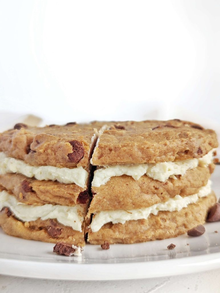 A lovely Protein Cookie Cake with protein frosting layered between protein cookies! This healthy cookie cake recipe uses protein powder for sweetener and is sugar free, gluten free, low fat and vegan too!