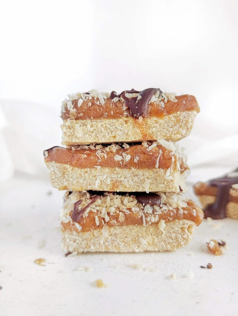 Spot on Healthy Samoa Protein Bars with a protein cookie base, low fat protein caramel, toasted coconut and sugar free chocolate drizzle. Healthy homemade Samoa cookie bars that taste just like the girl scout cookies!