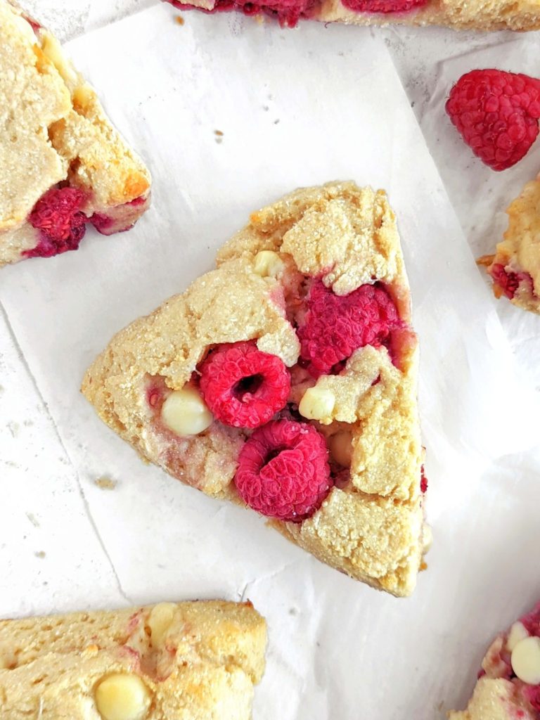 Perfectly soft and crumbly White Chocolate Raspberry Protein Scones with a ton of protein powder and greek yogurt! Healthy raspberry white chocolate scones without cream or sugar - low fat and sugar free.