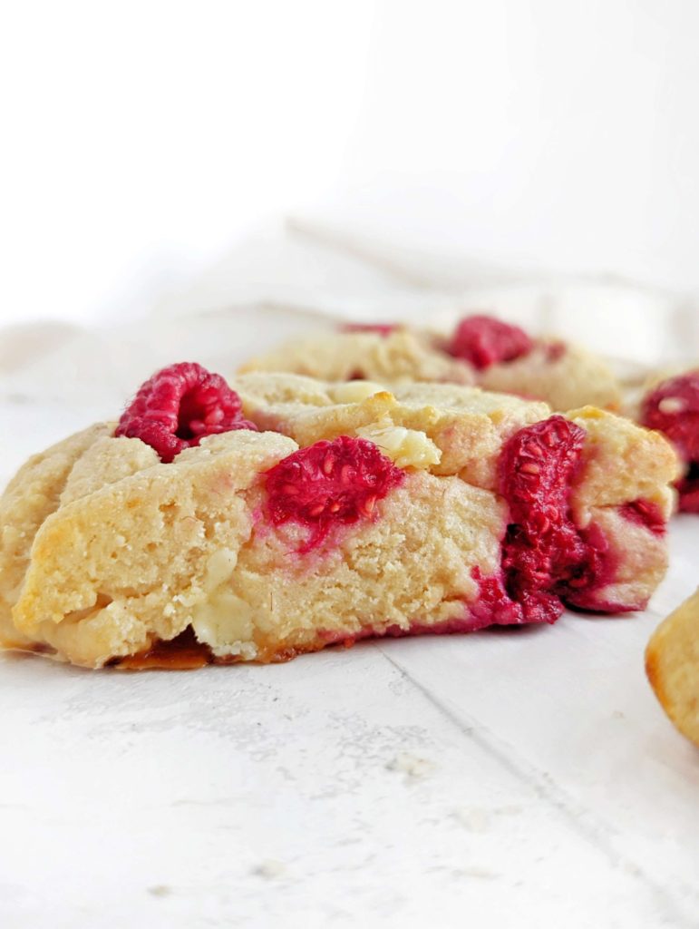 Perfectly soft and crumbly White Chocolate Raspberry Protein Scones with a ton of protein powder and greek yogurt! Healthy raspberry white chocolate scones without cream or sugar - low fat and sugar free.