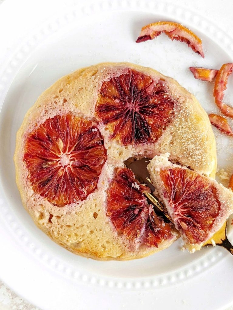 Beautiful Blood Orange Protein Cake for one made with a ton of protein powder and egg whites! This healthy blood orange mug cake is just like the upside down cake, but actually easy and has no sugar either.