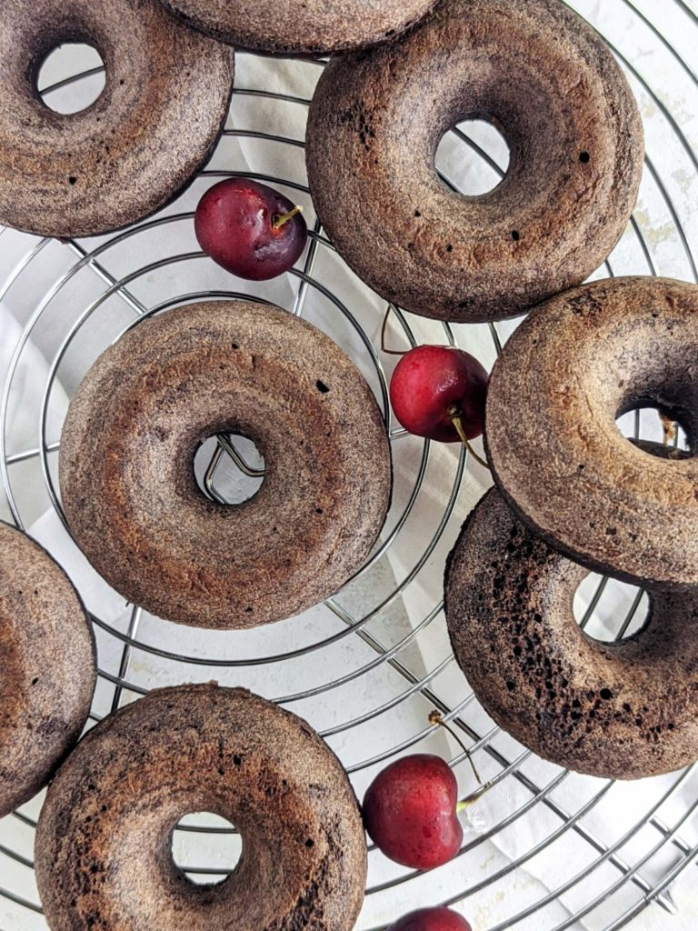 Just amazing Black Forest Protein Donuts with a rich chocolate protein cake donut, protein frosting and cherry topping! These black forest donuts are healthy, low fat and sugar-free too.