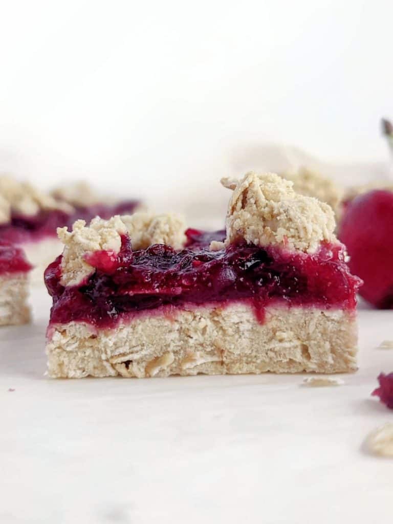 Beautiful Cherry Pie Protein Bars with a protein oatmeal base and no-sugar cherry filling! These high protein cherry oatmeal crumb bars are healthy, low sugar, low calorie and low fat too.