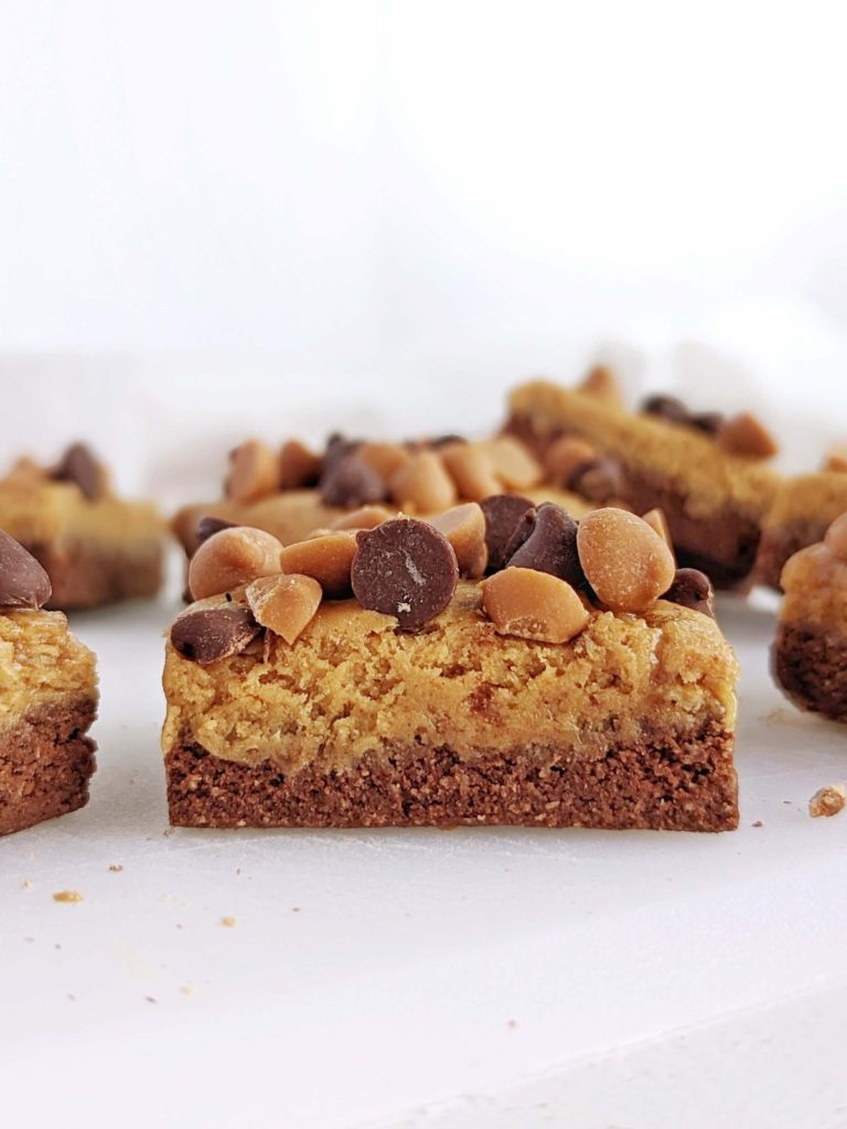 Soft and chewy Chocolate Butterscotch Protein bars with a base, caramel-y later and all the chocolate and butterscotch chips on top. Easy, no bake and healthy chocolate butterscotch squares for a sugar free treat.
