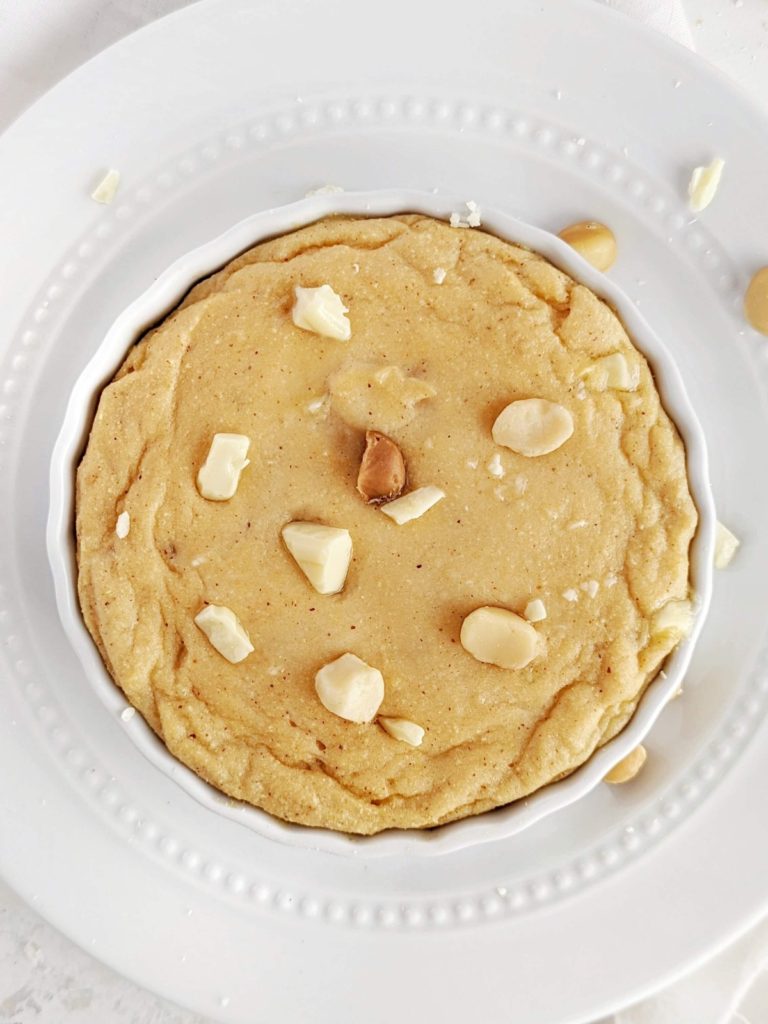 A luscious single serve soft-baked White Chocolate Macadamia Protein Cookie with a ton of protein powder and no sugar. Healthy white chocolate macadamia nut cookie is low fat and gluten free too!