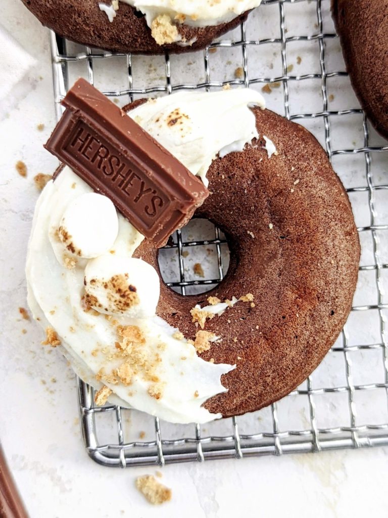 Unbelievable S’mores Protein Donuts complete with graham crackers, marshmallow and Hershey’s, but healthy! This S’mores donuts recipe uses protein powder and egg whites and are low sugar and low fat too.