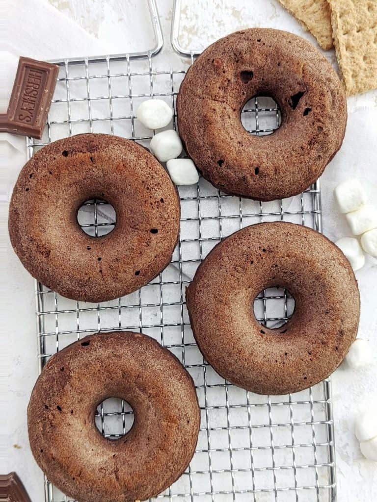 Unbelievable S’mores Protein Donuts complete with graham crackers, marshmallow and Hershey’s, but healthy! This S’mores donuts recipe uses protein powder and egg whites and are low sugar and low fat too.