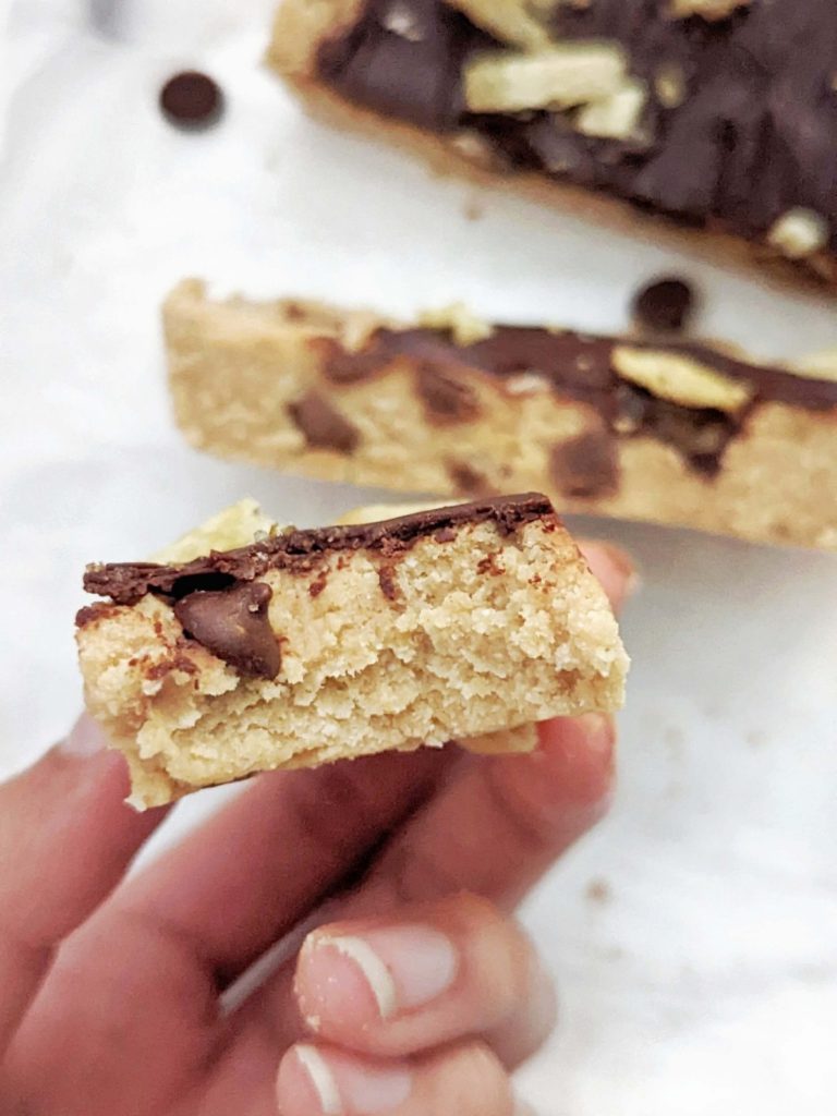Sweet and Salty Chocolate Chip Protein Bars with Potato Chips on top! These healthy cookie dough protein bars are low fat, sugar free, gluten free and quite guilt-free too.