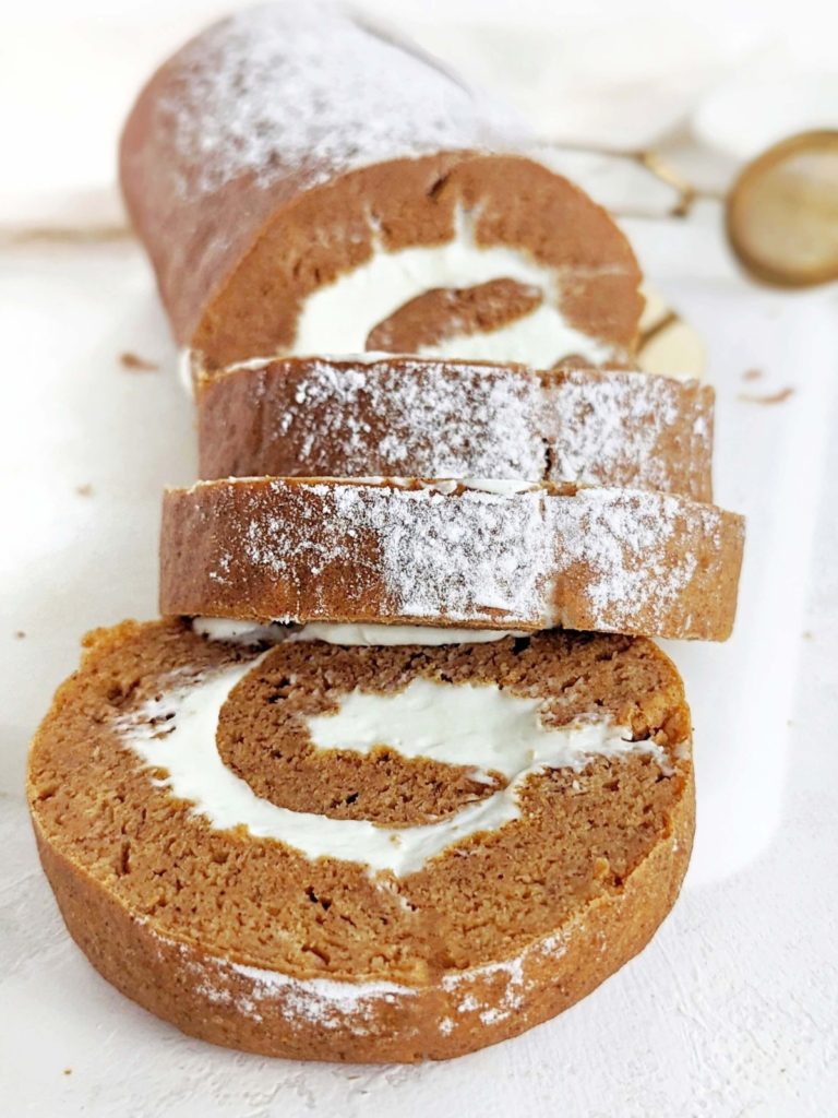 Gorgeous Protein Pumpkin Roll with protein cream cheese filling swirled inside a low fat and sugar free pumpkin cake. An easy, healthy pumpkin roll cake recipe to please any crowd!