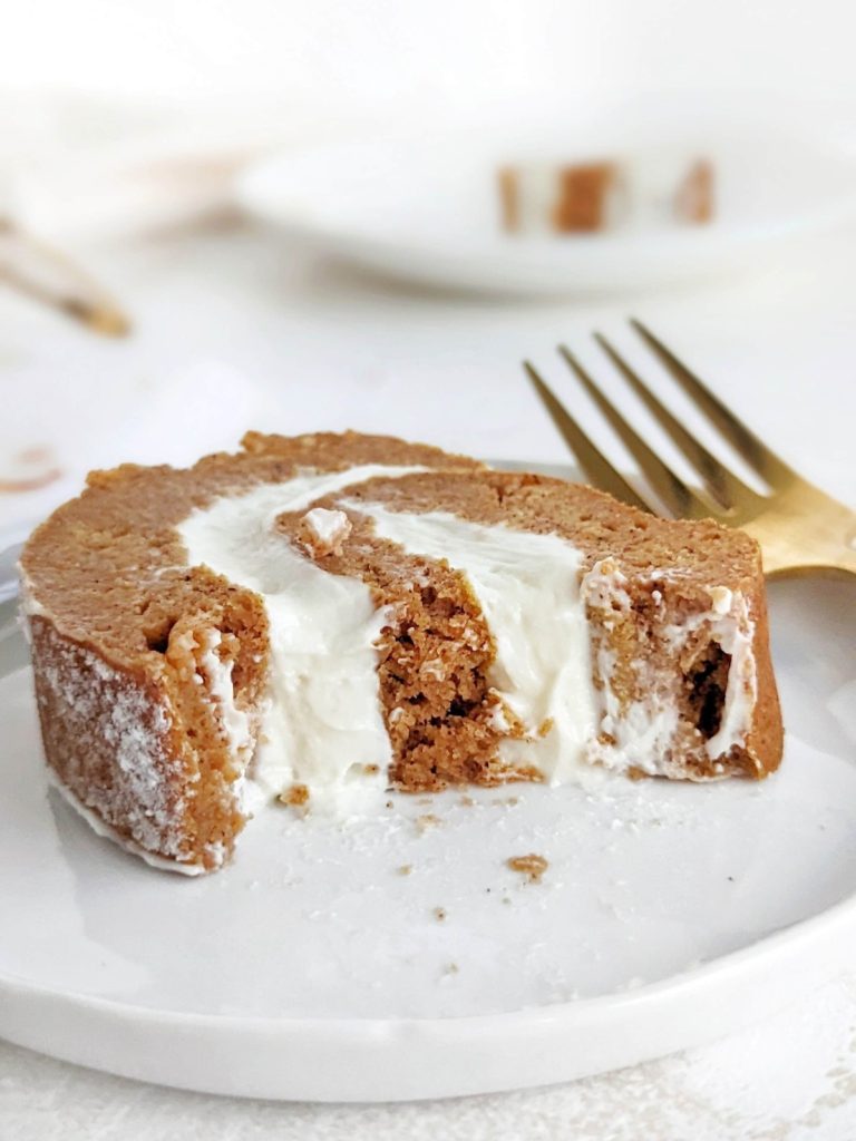 Gorgeous Protein Pumpkin Roll with protein cream cheese filling swirled inside a low fat and sugar free pumpkin cake. An easy, healthy pumpkin roll cake recipe to please any crowd!