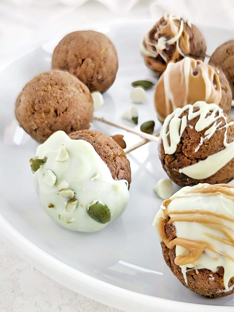 Addictive Pumpkin Protein Cake Pops with fresh-baked protein pumpkin cake, protein cream cheese frosting and sugar-free chocolate coating. Healthy pumpkin pie cake pops are low-calorie, low fat, sugar-free and easily Vegan too!