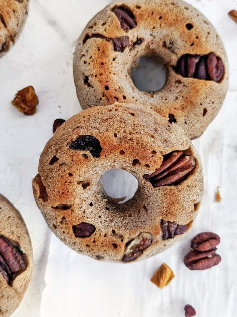 Super easy and high protein Fruitcake Donuts with no sugar added are perfect for Christmas! Healthy fruit cake donuts use protein powder for sweetness, but have all the spiced flavor and dried fruits you’d expect in this treat.