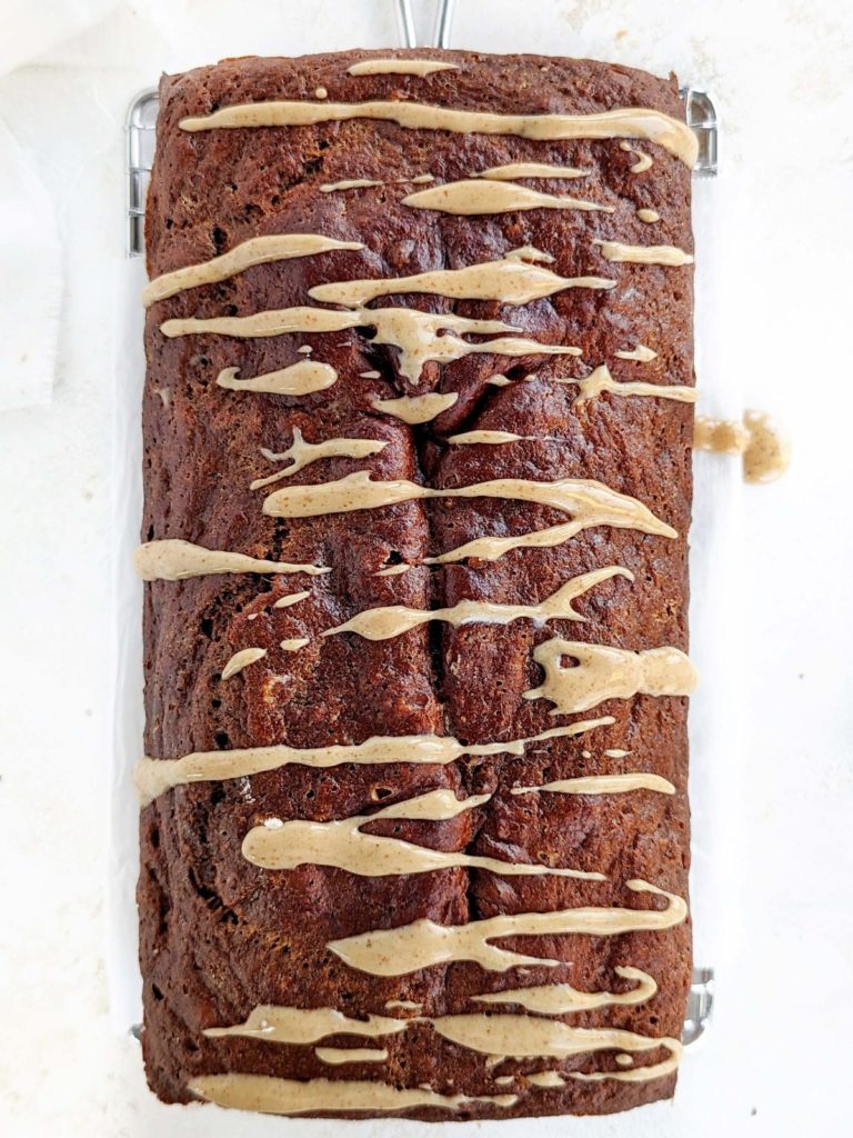 Healthy and low calorie Protein Gingerbread Loaf with a gingerbread almond glaze for extra Christmas flavor! High protein molasses bread has no oil, butter or sugar, but uses applesauce, protein powder and just the right amount of molasses.