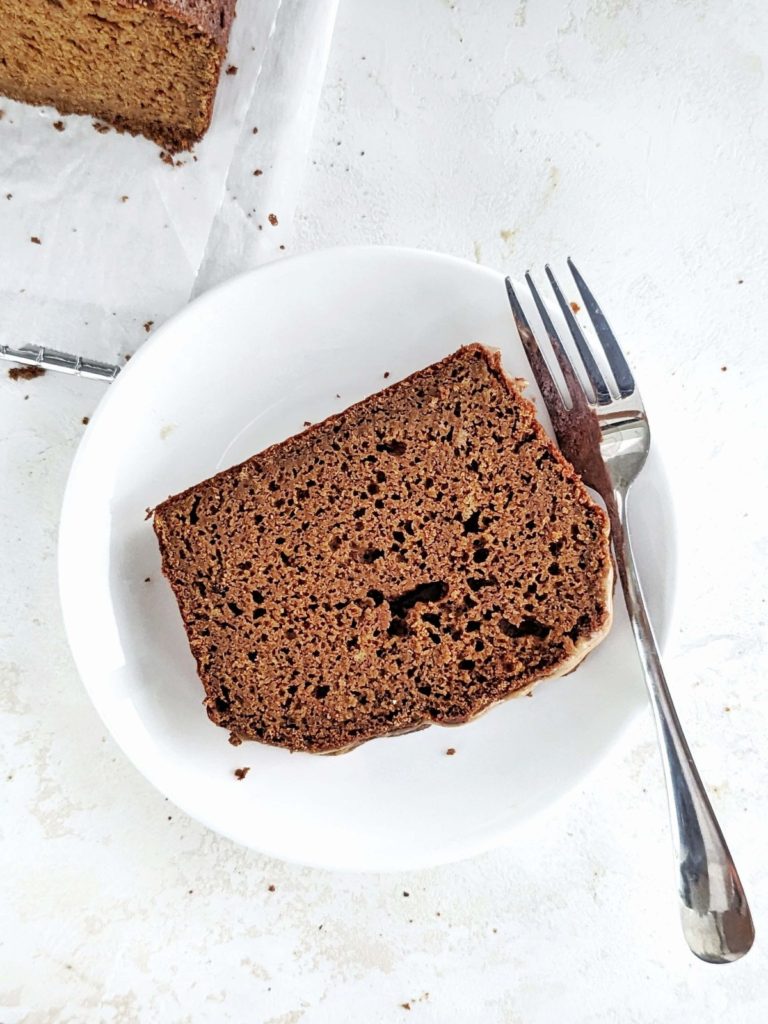 Healthy and low calorie Protein Gingerbread Loaf with a gingerbread almond glaze for extra Christmas flavor! High protein molasses bread has no oil, butter or sugar, but uses applesauce, protein powder and just the right amount of molasses.