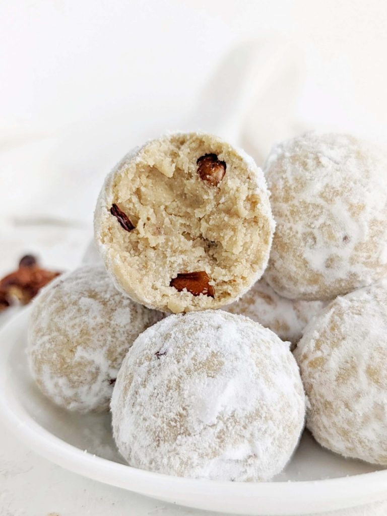 Melt-in-your-mouth Protein Snowball Cookies made healthy and sugar-free are perfect for the holidays! Easy Mexican wedding cookies have pecans, no butter and rolled in sugar-free powdered sugar.