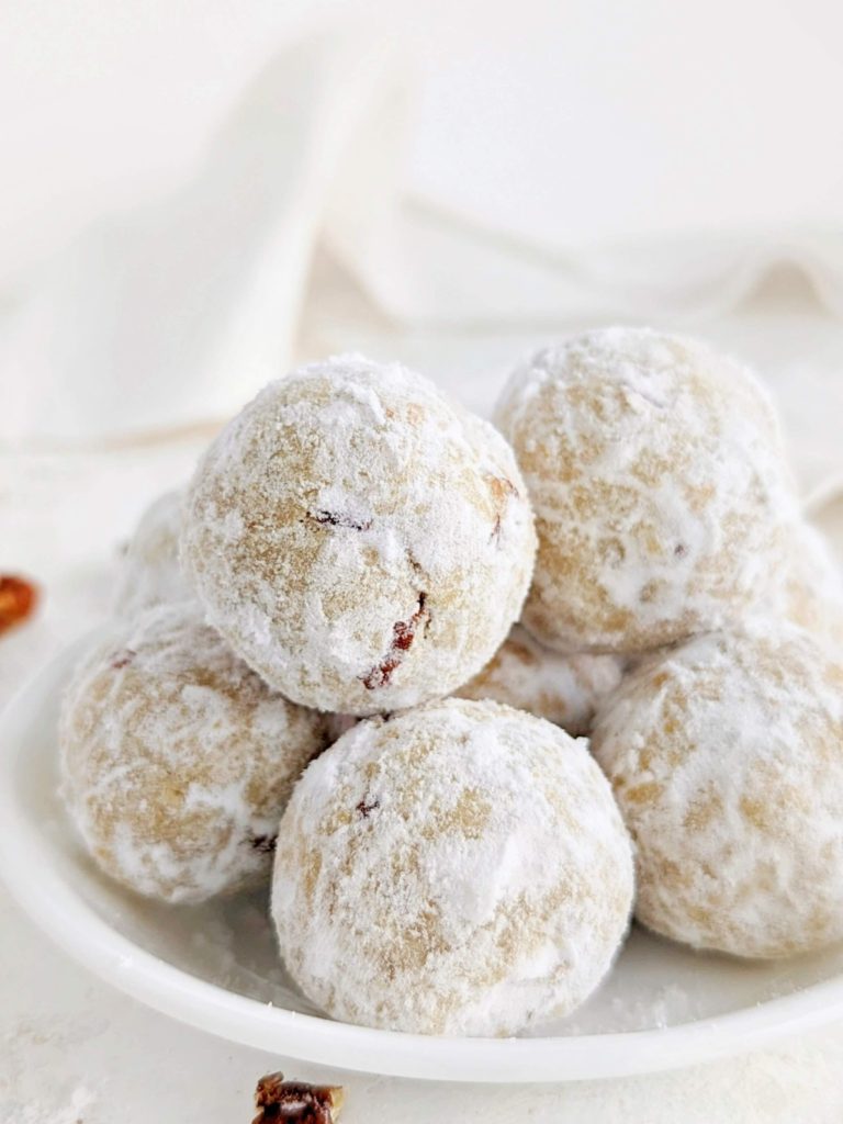 Melt-in-your-mouth Protein Snowball Cookies made healthy and sugar-free are perfect for the holidays! Easy Mexican wedding cookies have pecans, no butter and rolled in sugar-free powdered sugar.