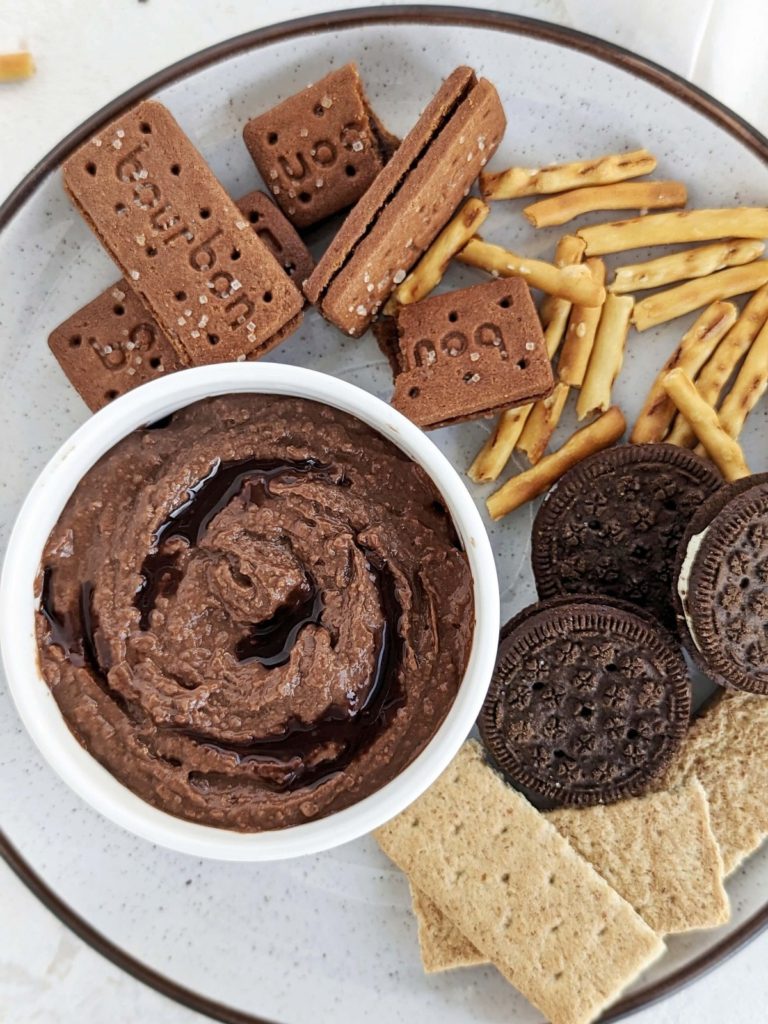 The best Chocolate Protein Hummus recipe made with chickpeas, protein powder and applesauce. Healthy chocolate chickpea dip is a great protein-packed snack for your next chip-and-dip party.