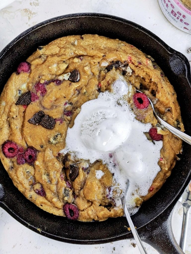Ultimate Oreo Raspberry Protein Skillet Cookie perfect for Valentine’s Day! Healthy raspberry skillet cookie recipe is low fat, low sugar and great with a scoop of ice cream.