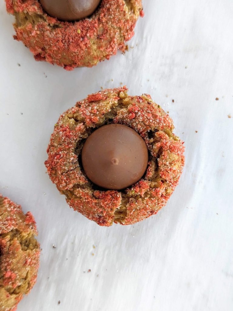 Extra love for Valentine’s Day Protein Cookies - healthy, low fat PB blossom cookie with V-day themed peanut butter, monkfruit and freeze dried strawberry coating, Hershey’s Kiss on top! 