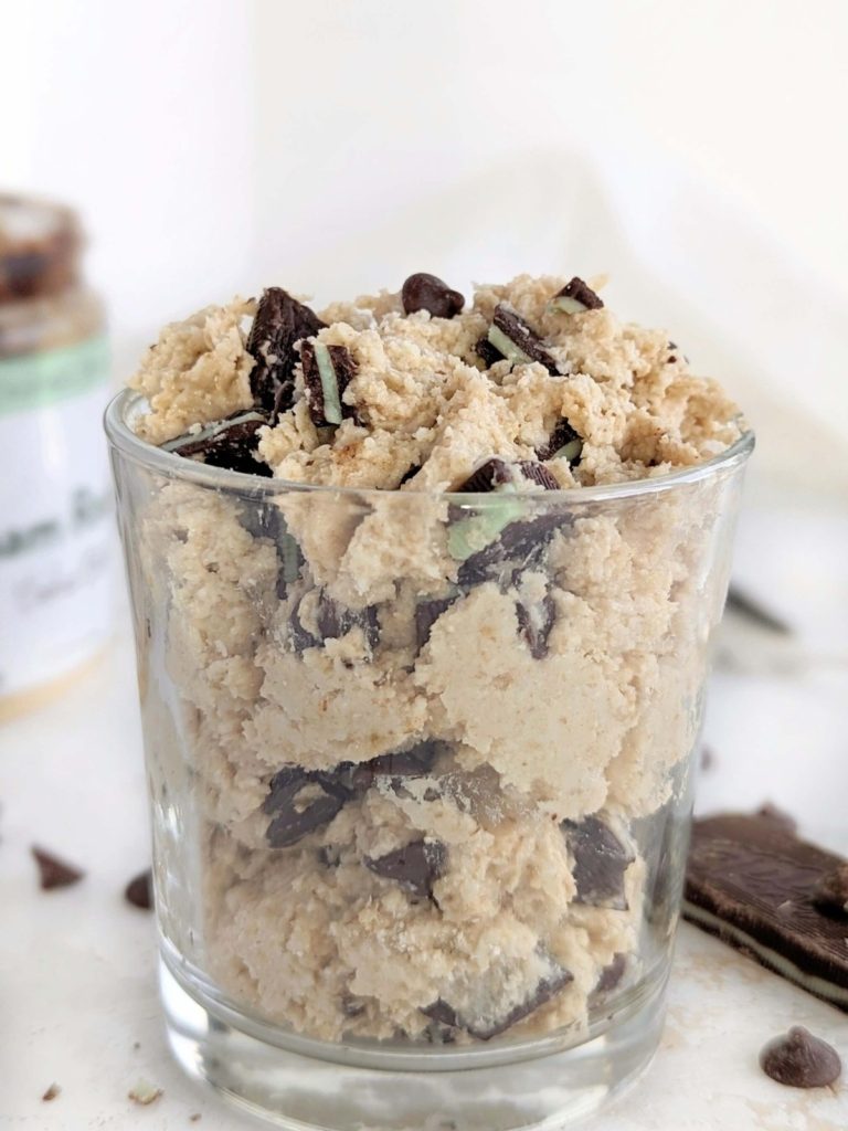 Indulgent and refreshing Mint Chocolate Chip Protein Cookie Dough - a healthy minty cookie dough made with protein powder and mint cashew butter loaded with sugar-free chocolate chips and mint chocolate candies!