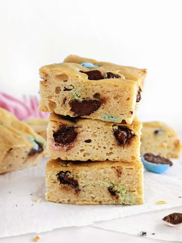 Mini Egg Protein Blondies so good you won’t believe they have no butter or extra sugar. Healthy Cadbury mini egg blondies use protein powder and a ton of Greek yogurt for a real great Easter recipe.