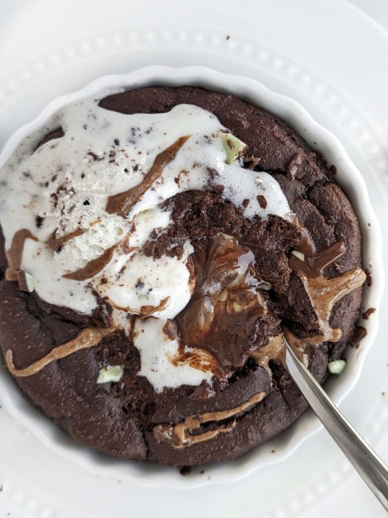 Indulgent Mint Chocolate Protein Dessert bowl that tastes like a fudgy half baked brownie! Easy, healthy single serve recipe with chocolate protein powder, mint chocolate candy and mint chocolate flavor almond butter too!