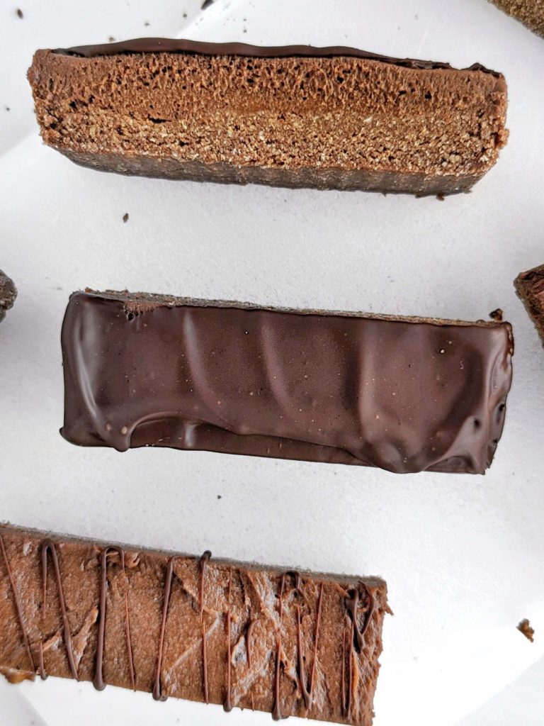 Chocolate Mousse Protein Bars are a healthy and delicious snack to indulge with no guilt. Easy, no bake recipe with a high protein chocolate base, mousse and chocolate topping.