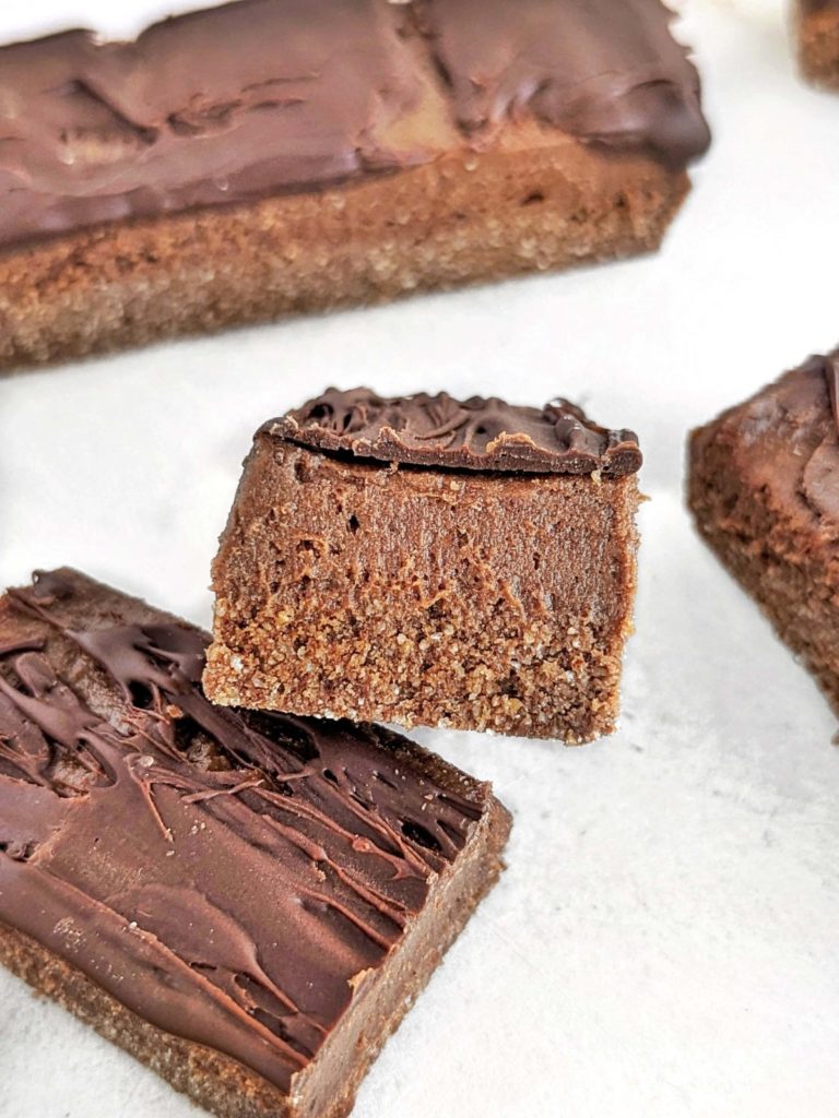 Chocolate Mousse Protein Bars are a healthy and delicious snack to indulge with no guilt. Easy, no bake recipe with a high protein chocolate base, mousse and chocolate topping.