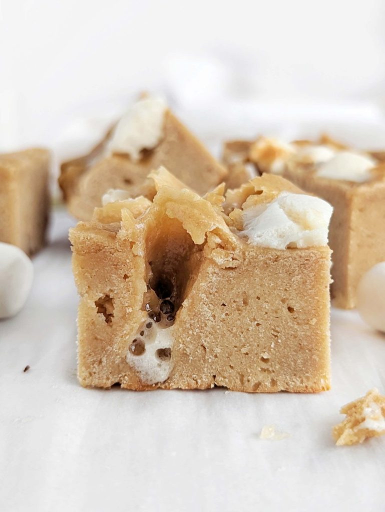 Fluffernutter Protein Bars loaded with peanut butter flavor and marshmallows are the perfect postworkout snack on-the-go or for a quick pick-me-up. Easy, healthy, low fat, low sugar and high protein fluffernutter bars!