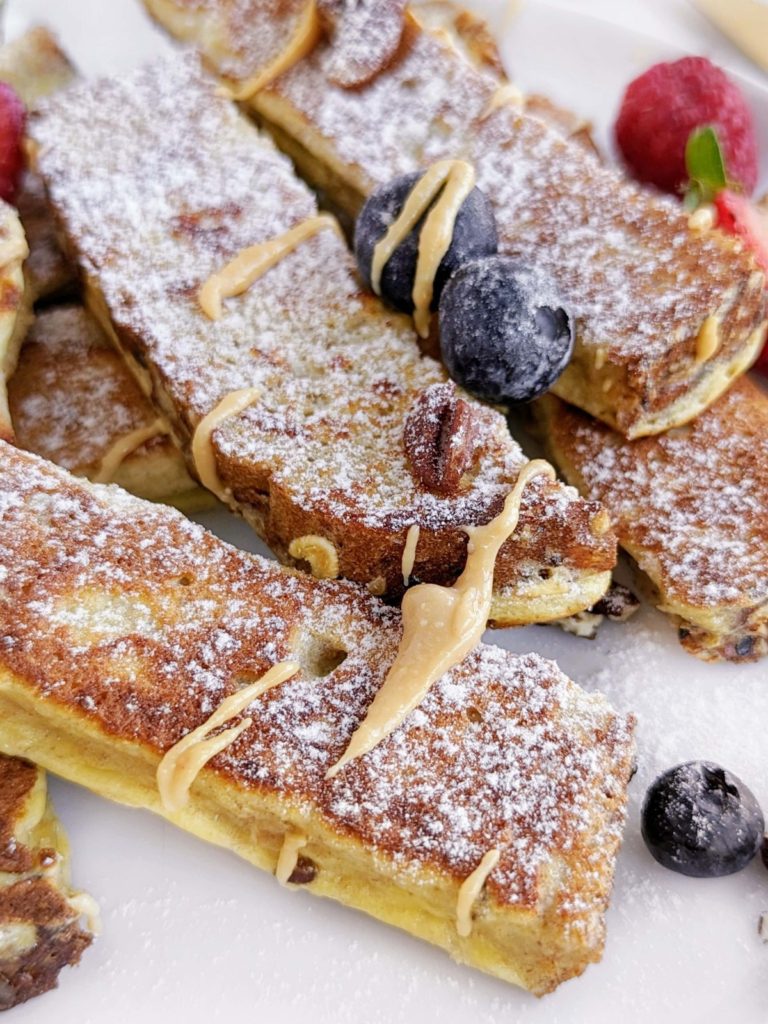 Peanut Butter Protein French Toast Sticks are a delicious and healthy breakfast everyone will love. Made with whole wheat bread and protein powder, pb French Toast sticks are a high fiber, lower calorie and low sugar option.