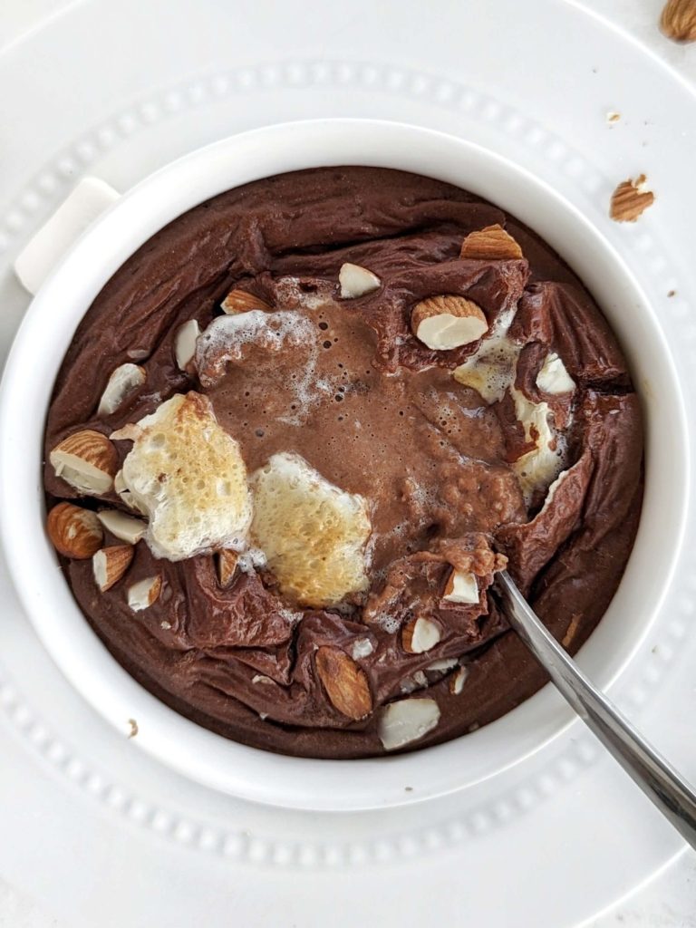 Rocky Road Protein Baked Oats are a delicious and nutritious breakfast or snack. Healthy rocky road oatmeal is made with rolled oats, protein powder, almond milk, and has your favorite ice cream toppings: marshmallow and almonds.