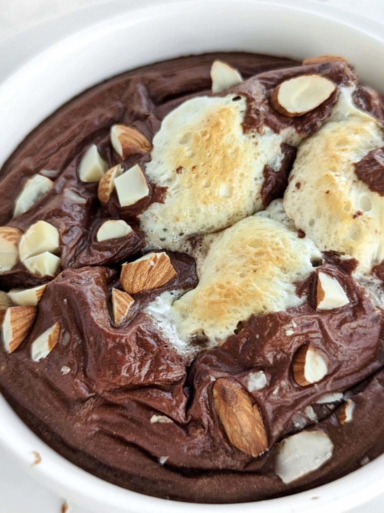 Rocky Road Protein Baked Oats are a delicious and nutritious breakfast or snack. Healthy rocky road oatmeal is made with rolled oats, protein powder, almond milk, and has your favorite ice cream toppings: marshmallow and almonds.