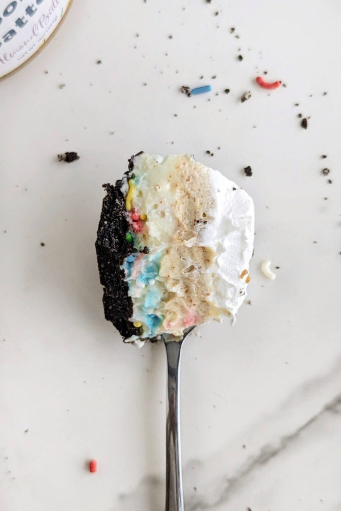 Oreo Birthday Cake Dessert Lasagna is the high protein dessert of your dreams! Oreo base, birthday cake protein pudding, Oreo birthday cake protein pudding and whipped topping too - all healthy and low sugar.