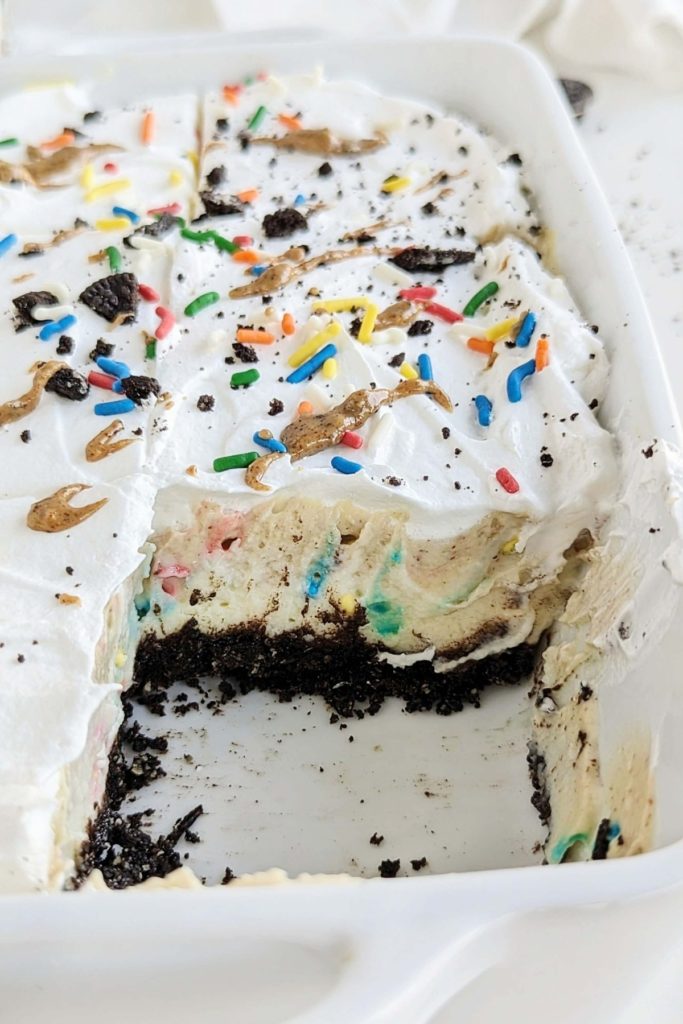 Oreo Birthday Cake Dessert Lasagna is the high protein dessert of your dreams! Oreo base, birthday cake protein pudding, Oreo birthday cake protein pudding and whipped topping too - all healthy and low sugar.