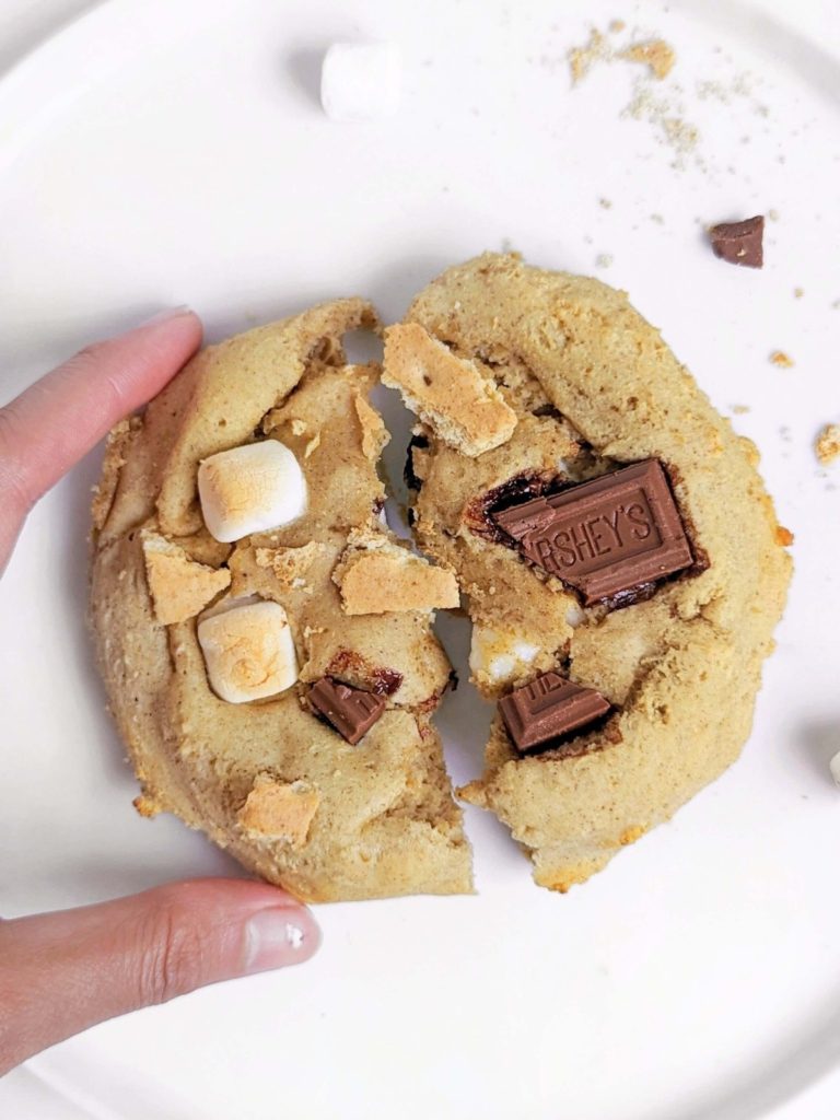 A giant single S’mores Protein Cookie recipe made with oat flour, sweetened with protein powder and topped with chocolate and marshmallow! Single serving baked protein cookie is a healthy dessert for one and will leave you wanting s’more.