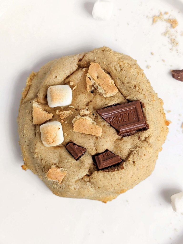 A giant single S’mores Protein Cookie recipe made with oat flour, sweetened with protein powder and topped with chocolate and marshmallow! Single serving baked protein cookie is a healthy dessert for one and will leave you wanting s’more.