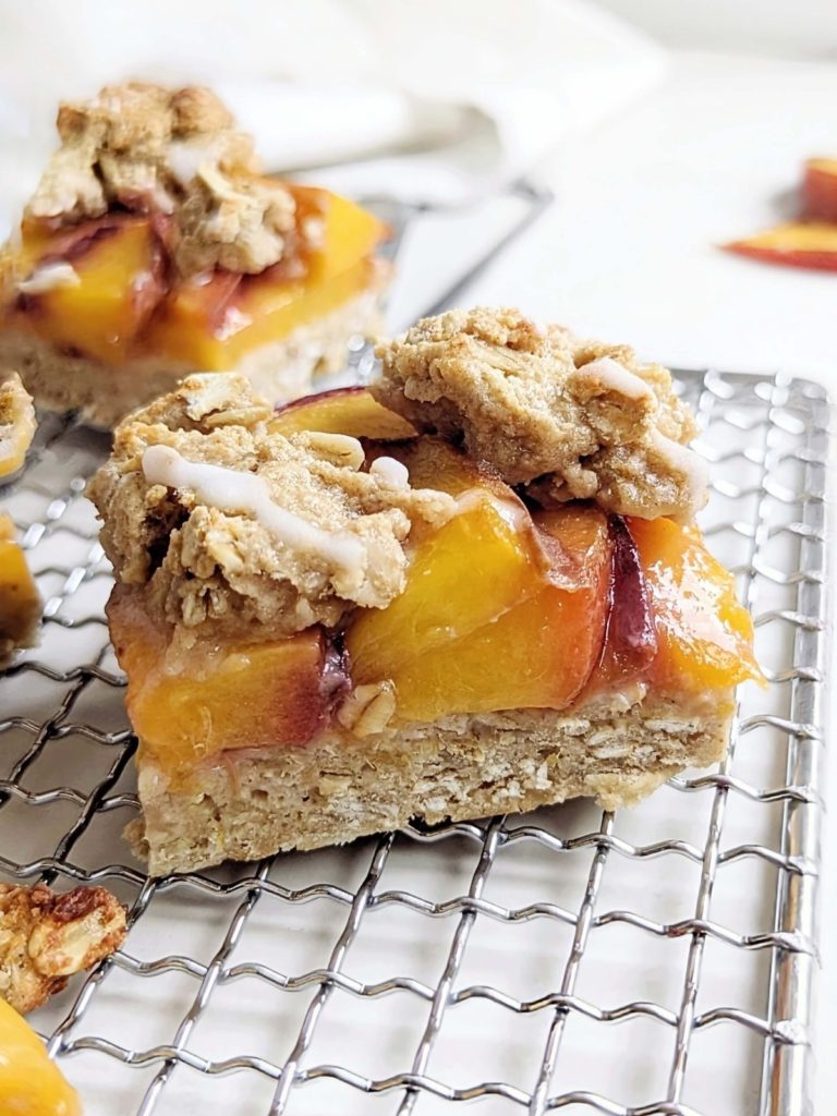 Healthy Peach Crumb Bars - a delightful balance between indulgence and nourishment. With oats, protein powder and egg white these peach crumble bars are high protein, low fat, and added sugar free!